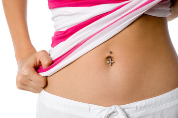 A woman shows off her belly button piercing
