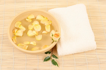 bowl of pure water rose and towel
