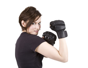 Brunette woman in boxing attire smiling at the camera.
