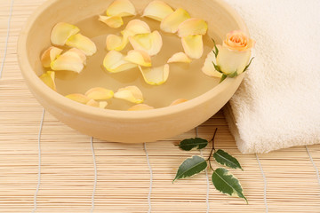 bowl of pure water rose and towel