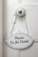A Do No Disturb sign on a white door