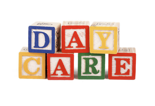 Abc blocks lined up to spell the word daycare - isolated