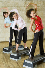 Fototapeta premium A group of young women exercising in the fitness club.