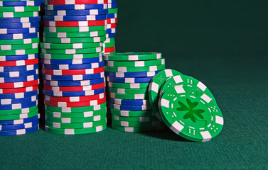 Plastic chips on a cloth with a shamrock depicting Irish Luck.