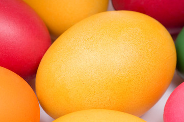 Colorful Easter eggs in red, yellow and orange color. Detail.