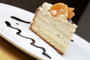 a piece of orange pie on the white plate