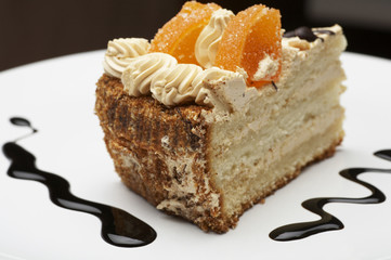 a piece of orange pie on the white plate