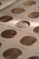 U S state quarters coin collection in book