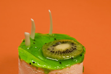 Kiwi cake on orange background