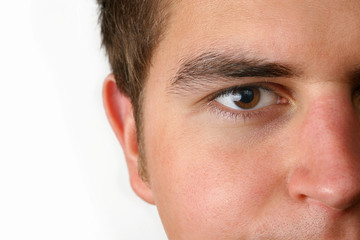 young man part of face over white background