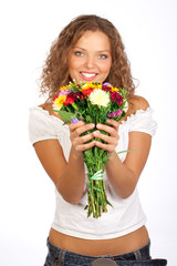 Happy young smiling woman with flowers.