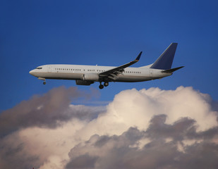 Fototapeta na wymiar Airplane with clouds