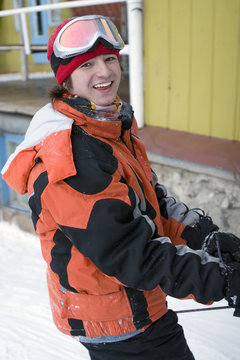 A health lifestyle image of young adult snowboarder