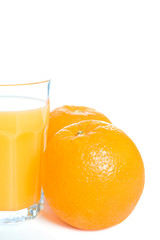 Oranges and a glass of orange juice
