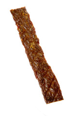 A single dried beefstick or jerky isolated over white.