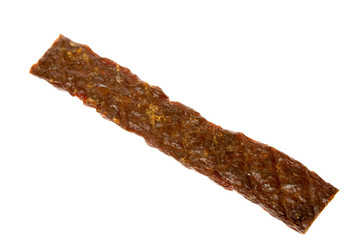 A single dried beefstick or jerky isolated over white.