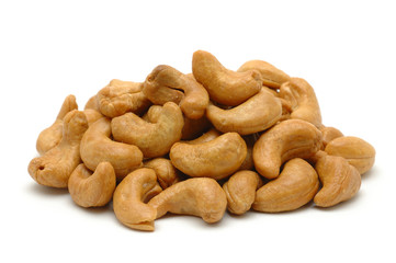 Pile of roasted cashew nuts in isolated white background