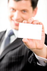 Image of confident entrepreneur with salutatory card in hand