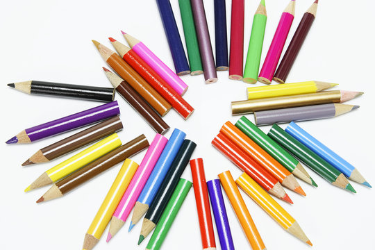 An Arrangement of Color Pencils on White Background