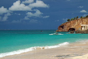 Obraz premium View of Caribbean Beach with Storm Clouds Approaching