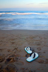 sandals on beach with long exposure