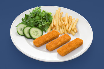 Three fish fingers on white plate with fries and salad
