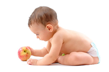 Baby with healthy fruits on white background .