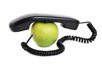 Green apple with handset and connected wire
