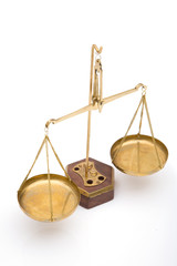 scales of justice close up on white background, shallow dof
