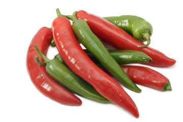 Group of red and green pepper on white