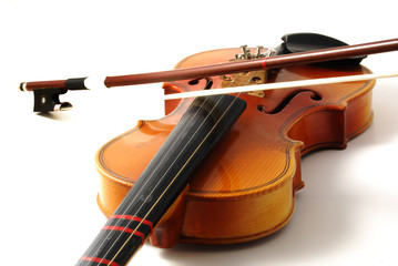 An old violin on a white background