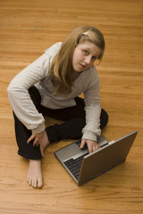 A young girl working on her laptop