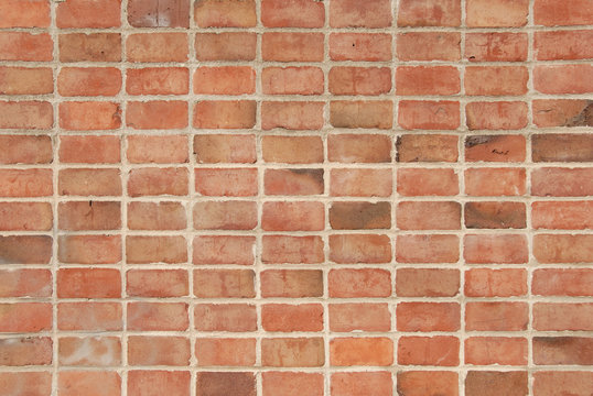 Background image of multi-colored fired brick wall.