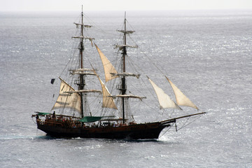 Pirate ship that is out to sea and sailing away