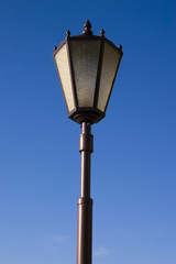 Fototapeta na wymiar Single lantern on a background of the blue sky