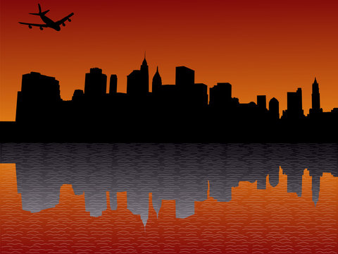 plane flying over Lower Manhattan skyline at sunset