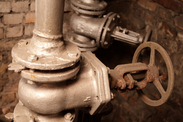 The rusty faucet in the boiler house