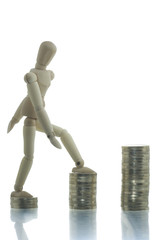 Manikin going up three coin piles