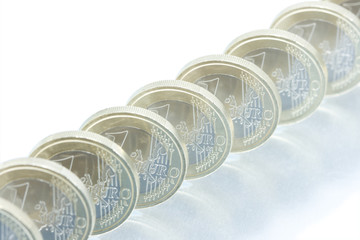 Euro coins line pattern with reflection