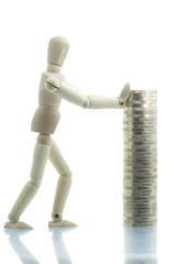 Manikin pushing coins pile with both hands
