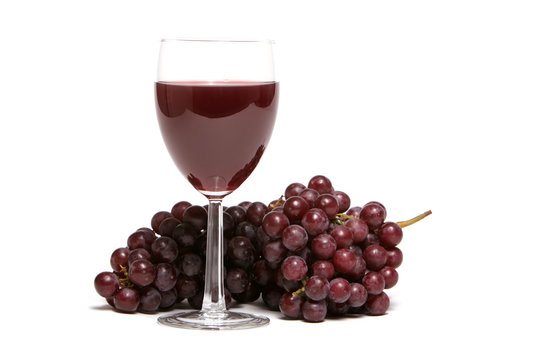 Red grapes and a glass of red wine