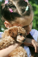 Little girl and puppy.