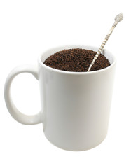 Cup of ground coffee isolated over white