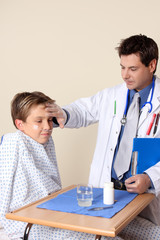 Fototapeta premium Doctor checks up on a young patient