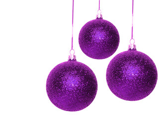 violet Christmas balls over white background