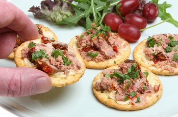 Canapes with Ardennes pate on cheese biscuits