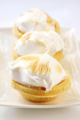 Lemon meringue tarts.   Sweet dessert treats.