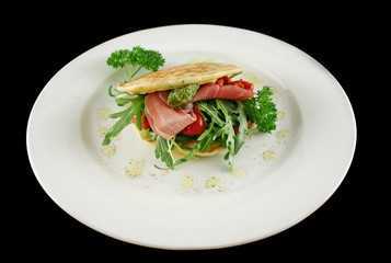 Corn fritters with prosciutto, sundried tomatoes and pesto.