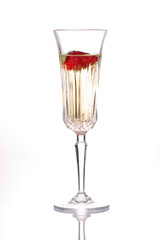 Closeup of glass of Champagne with strawberry in it
