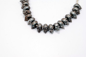 pewter skulls on string